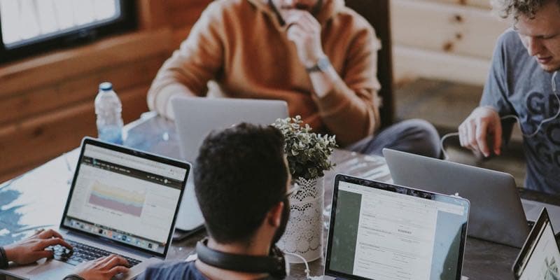 Business team meeting discussing booking strategy